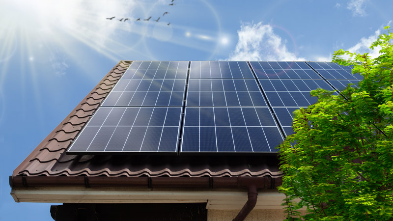 Sun shining on solar panels on California home