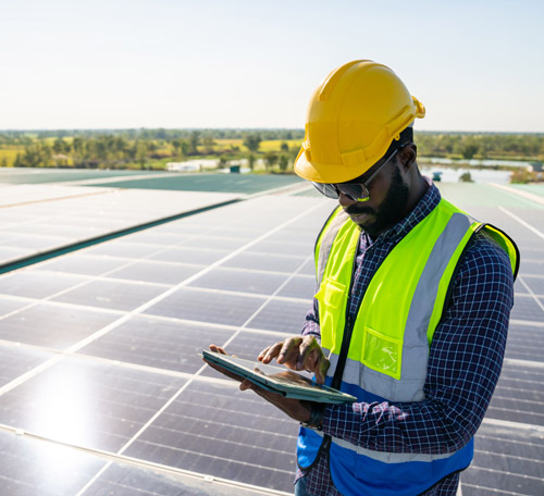 Man working on solar panels after successful solar sales